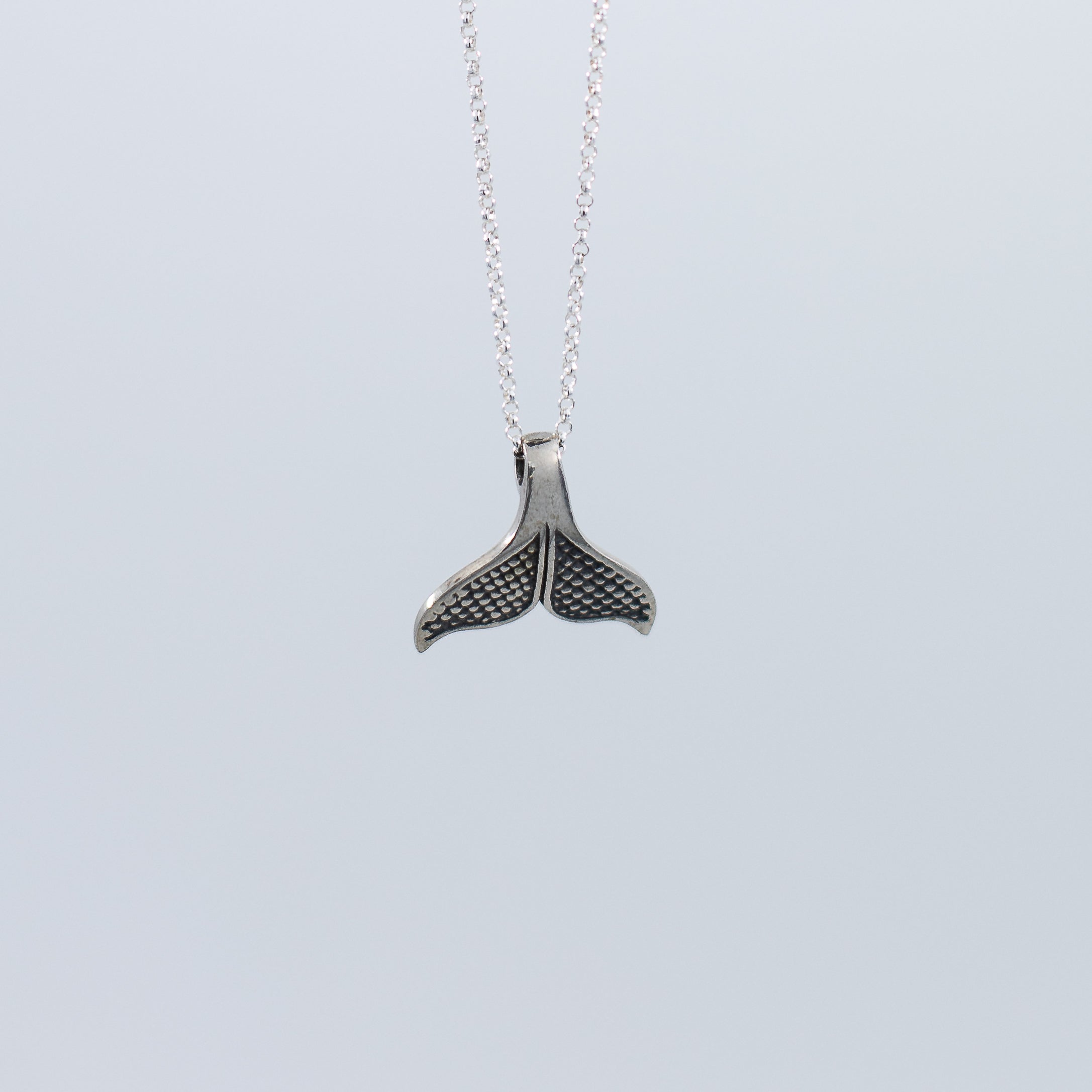 Whale tail pendant