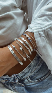 Laminated braided bracelet